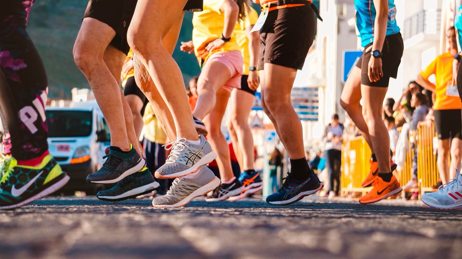 Runners wearing running shoes during a road race